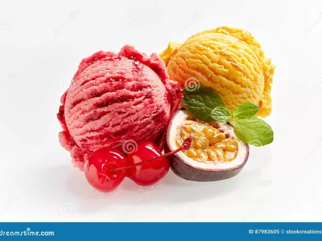 Fruit ice cream scoops served with passion fruit and candied cherries