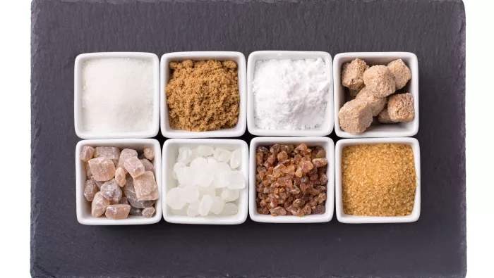 Different types of sugar (white & brown sugar cubes, and granulated sugar)) 