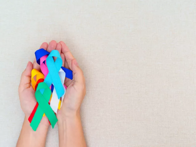 Hands holding ribbons