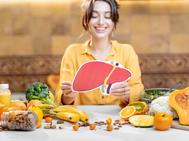 Lady holding image of a liver