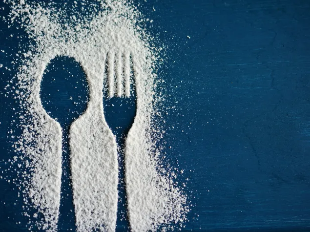 Fork and spoon outline in sugar