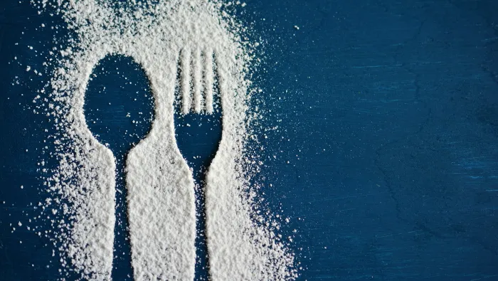 Fork and spoon outline in sugar