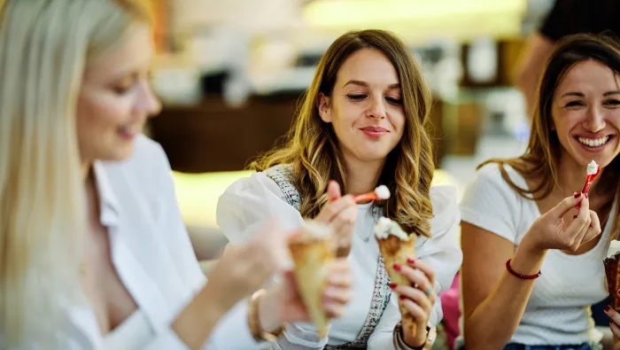 Happy girls eating ice cream