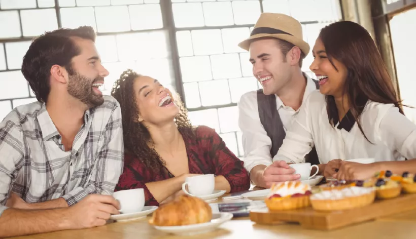 Friends laughing showing teeth