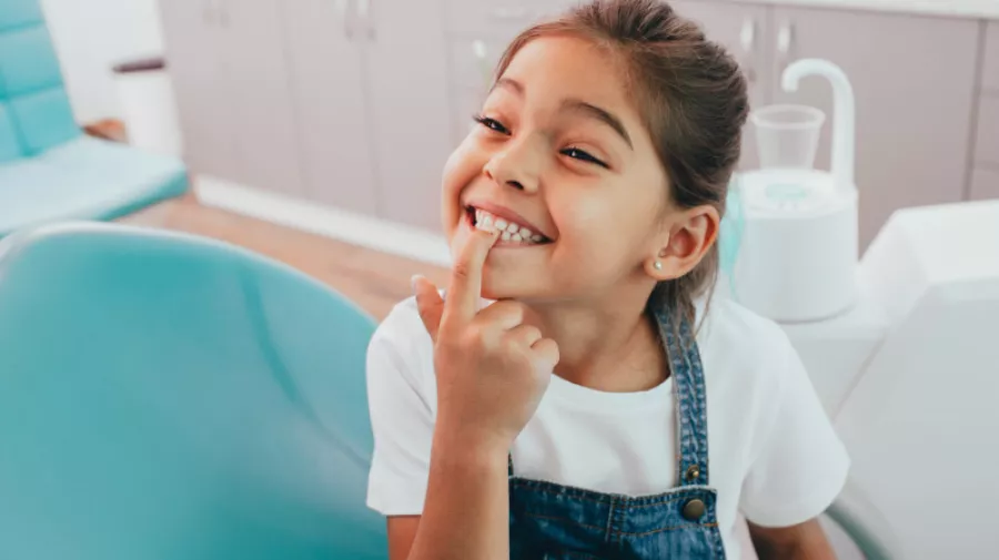 Little girl showing clean teeth