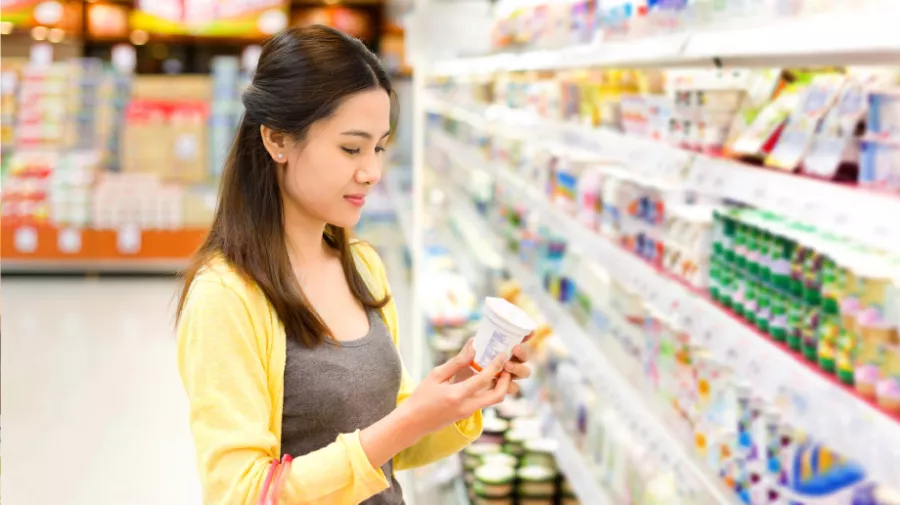 Lady with yogurt pot