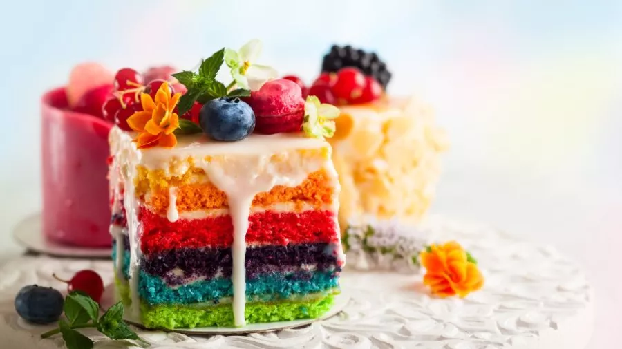 Slices of rainbow coloured cake